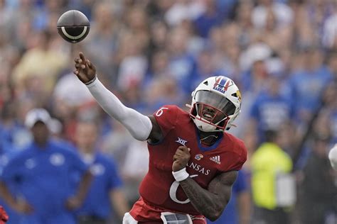 Daniels throws 3 TD passes, KU gets 2 defensive scores to beat BYU 38-27  in its Big 12 debut